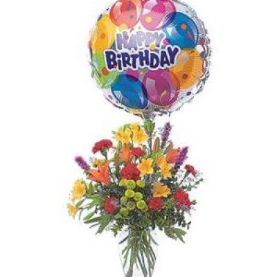Take their birthday to brand new heights with this colorful arrangement of flowers and a high-flying birthday balloon.
Alstroemeria, carnations, chrysanthemums and lilies are delivered in a clear glass vase with attached foil balloon.