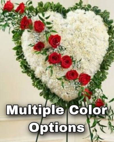 This beautiful floral tribute shows your undying love during this difficult time. This standing spray arrangement in the shape of a heart is created from fresh white carnations, red roses, baby's breath and more. Traditionally sent directly to the funeral home by family members or friends and displayed on a stand.