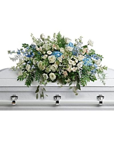 <div id="mark-1" class="m-pdp-tabs-marketing-description">

<hr />



<hr />

Like wisps of clouds in a bright blue sky, this breathtaking spray of hydrangea, roses and alstroemeria refreshes and inspires. A beautiful way to remember your loved one.

</div>
<div id="desc-1">
<ul>
 	<li>This stunning spray includes blue hydrangea, white roses, white spray roses, white alstroemeria, white lisianthus, blue delphinium, white larkspur, white stock, white waxflower, dusty miller, huckleberry, asparagus plumosus, pitta negra, lily grass, dagger fern, and lemon leaf.</li>
</ul>
</div>