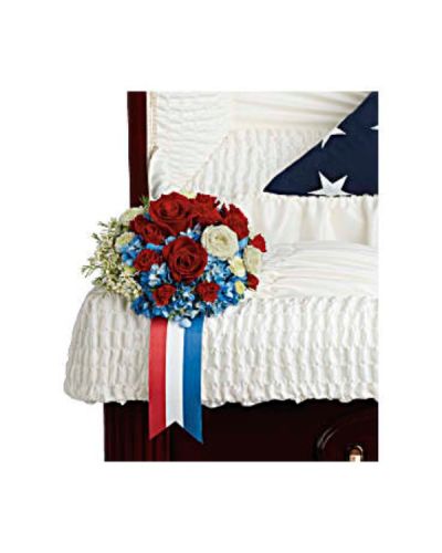 <div id="mark-1" class="m-pdp-tabs-marketing-description">Adorn the casket with a proud display of patriotism. This breathtaking arrangement of blue hydrangea and rich red and white roses is a touching tribute to an honorable legacy.</div>
<div id="desc-1">
<ul>
 	<li>Blue hydrangea, red roses, red spray roses, white spray roses, white button spray chrysanthemums, and white waxflower are accented with galax leaf.</li>
</ul>
</div>