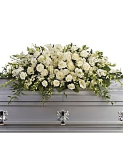 <div id="mark-1" class="m-pdp-tabs-marketing-description">The peaceful purity of this all white casket spray is a touching, inspiring way to honor the departed. Large in scale, the lush arrangement is ideal for a full couch or closed casket service, featuring elegant white blooms such as calla lilies, dendrobium orchids and hydrangea.</div>
<div id="desc-1">
<ul>
 	<li>White roses, orchids, large calla lilies and perfect stems of hydrangea.</li>
</ul>
</div>