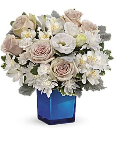 <div id="mark-3" class="m-pdp-tabs-marketing-description">Bursting with gorgeous roses and blooms, this cobalt glass cube vase is a gorgeous gift that can also serve as a beautiful candleholder!</div>
&nbsp;
<div id="desc-3">This splendid bouquet features crème roses, white cushion spray chrysanthemums, white lisianthus, white alstroemeria, miniature white carnations, dusty miller and variegated pittosporum.</div>