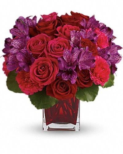 <div class="m-pdp-tabs-description">
<div id="mark-3" class="m-pdp-tabs-marketing-description">Simply breathtaking! Spoil her any day of the week with this decadent gift of red and pink roses, accented with delicate purple alstroemeria and hand-delivered in a gorgeous red glass cube.</div>
</div>
<p id="arrngDescp">This lush arrangement features red roses, dark pink roses, purple alstroemeria, hot pink carnations and galax leaves.</p>