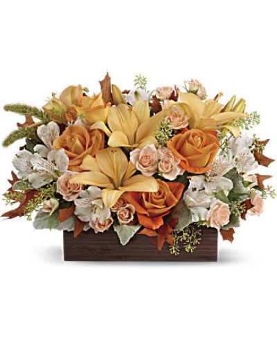 <div id="mark-3" class="m-pdp-tabs-marketing-description">Simply chic and overflowing with fall blooms! This gorgeous arrangement is sure to impress with its glorious shades of autumn - combining orange roses, peach lilies and seasonal brown leaves. Hand-delivered in a dark-toned bamboo rectangle.</div>
&nbsp;
<div id="desc-3">
<ul>
 	<li>This impressive arrangement features light orange and peach roses, peach asiatic lilies and white alstroemeria, and finished with dusty miller, seeded eucalyptus and millet.</li>
</ul>
</div>