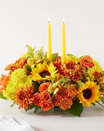 Enjoy a candlelit dinner with this colorful arrangement that embraces every shade of fall.