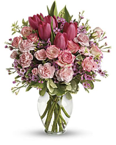 It's beauty-full! Bursting with tantalizing tulips and radiant roses, this delightful pink arrangement brings spring joy to that special someone.
Includes pink roses, tulips, carnations and waxflower, accented with fresh pitta negra and variegated pittosporum.
Delivered in a lovely glass vase.