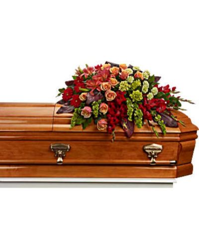 <div id="mark-1" class="m-pdp-tabs-marketing-description">Bring majesty to the service with this gorgeous casket spray of orange roses and lilies and other brilliantly colored floral favorites. A touching tribute for someone special.</div>
<div id="desc-1">
<ul>
 	<li>The magnificent arrangement includes green miniature hydrangea, orange roses, dark orange asiatic lilies, red gerberas, red gladioli, green carnations and bells of Ireland, accented with assorted greenery.</li>
</ul>
</div>