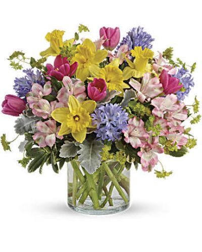 Celebrate the joy of the new season with this springtastic bouquet! Fresh and colorful in spring's favorite pastel hues, this mix of tulips, hyacinths and daffodils brings spring in!
Hot pink tulips, light pink alstroemeria, yellow daffodils and lavender hyacinth are mixed with bupleurum, dusty miller and pittosporum.
Delivered in a clear cylinder vase.