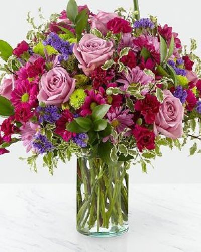 Dazzle your loved ones with stunning violet and green hues set within a glass cylinder vase. A collection of roses, daisies and statice, our Sweet Nothings Bouquet sends sweet sentiment deep within each bloom.

STANDARD
C Quantity Color Description
2 Lavender 50 cm Standard Rose
2 Green Button Pom
2 Lavender Daisy Pom
3 Purple Daisy Pom
3 Magenta Miniature Carnation
1 Purple Filler - Sinuata Statice
4 Green Green - Israeli Ruscus
2 Varigated Green - Pittosporum Italian

DELUXE

C Quantity Color Description
6 Lavender 50 cm Standard Rose
3 Green Button Pom
3 Lavender Daisy Pom
4 Purple Daisy Pom
4 Magenta Miniature Carnation
2 Purple Filler - Sinuata Statice
4 Green Green - Israeli Ruscus
2 Varigated Green - Pittosporum Italian

PREMIUM
C Quantity Color Description
8 Lavender 50 cm Standard Rose
4 Green Button Pom
4 Lavender Daisy Pom
5 Purple Daisy Pom
6 Magenta Miniature Carnation
3 Purple Filler - Sinuata Statice
6 Green Green - Israeli Ruscus
2 Varigated Green - Pittosporum Italian