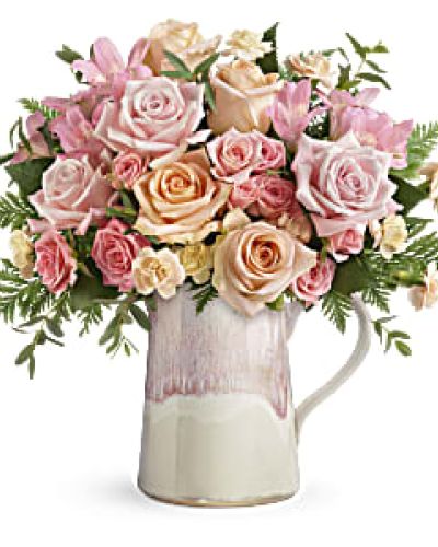 Sure to make her blush, this Mother’s Day gift is as sweet as they come! Nothing’s prettier than a delicate bouquet of pink and peach roses, presented to perfection in this artisanal ceramic pitcher with gorgeous, iridescent reactive glaze.