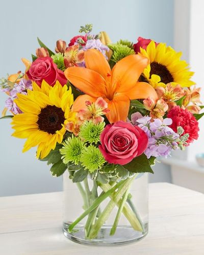 Like a blast of spring weather, our vibrant bouquet delivers your sentiments to someone special. A rich gathering of yellow and orange blooms, with pops of bright pink and purple, it’s more than a gift – it’s a way to express how you feel inside.